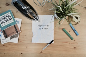 A piece of paper with "Marketing Strategy" written on it.