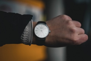 A person showing a watch.