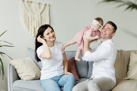happy parents with a baby.