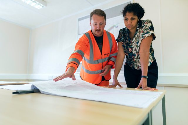 A person talking to a contractor.