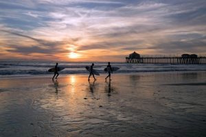Surfers in Huntington Beach, CA.